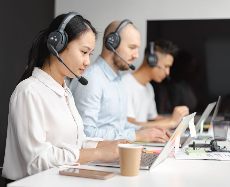 Customer support working on laptop Customer support working on laptop